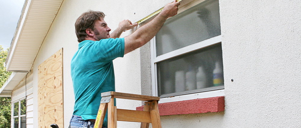 Man Fixing Window